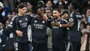 Dua gol dari Vinicius membawa Real Madrid menang dengan skor 2-1 dan membuat Los Blancos lolos ke babak perempat final Liga Champions 2025/2026. (AFP/Paul Ellis)