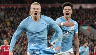 Pemain Manchester City, Erling Haaland, melakukan selebrasi setelah mencetak gol ke gawang Liverpool pada laga Liga Inggris di Stadion Anfield, Senin (9/2/2026) dini hari WIB. (AP Photo/Jon Super)