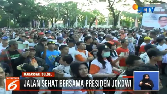 Antusias Ribuan Warga Makassar Ikut Jalan Sehat Bareng Jokowi