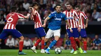 Aksi Cristiano Ronaldo pada saat Juventus berhadapan dengan Atletico Madrid. (AFP/Oscar del Pozo)
