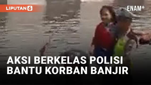 Salut! Polisi Bantu Ibu-ibu yang Terjebak Banjir