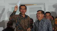 Presiden terpilih Joko Widodo dan Jusuf Kalla adakan jumpa pers di Rumah Transisi, Jakarta (15/9/2014) (Liputan6.com/Herman Zakharia)
