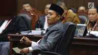 Saksi dari tim hukum Jokowi-Ma'ruf, Anas Nashikin saat bersaksi dalam sidang sengketa Pilpres 2019 di Gedung MK, Jakarta, Jumat (21/6/2019). Sidang tersebut beragendakan mendengar keterangan saksi dan ahli dari pihak terkait yakni paslon nomor urut 01 Jokowi-Ma'ruf Amin. (Liputan6.com/Johan Tallo)