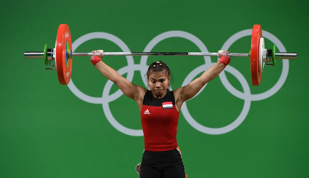 Total angkatan Sriw Wahyuni itu lebih ringan delapan kg dari lifter Thailand, Sopita Tanasan, yang membukukan 200 kg (92 kg Snatch dan 108 kg Clean & Jerk) untuk menyabet emas. (AFP/Goh Chai Hin)