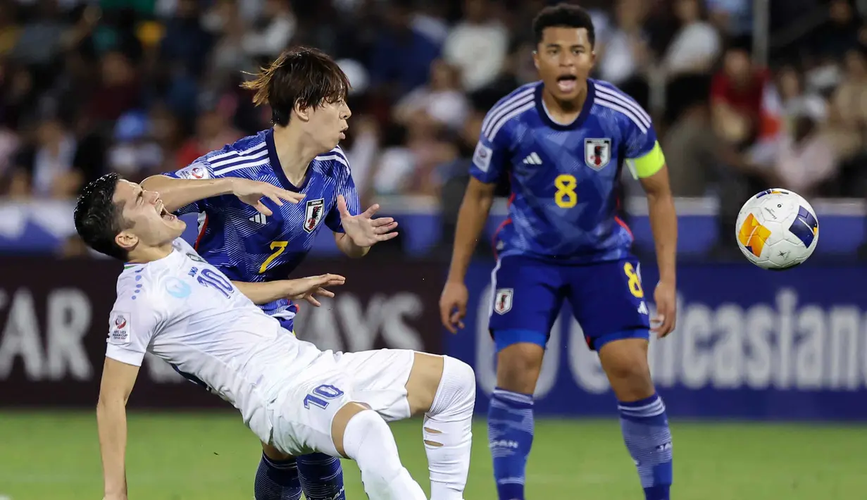 Pada menit ke-90+1, Timnas Jepang berhasil merubah skor lewat gol Fuki Yamada. (KARIM JAAFAR/AFP)