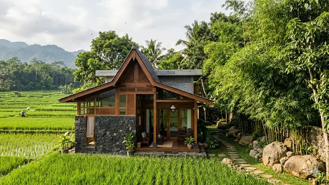 Desain Rumah Desa Adem dengan Taman Samping dan Dinding Batu Alam. Gemini
