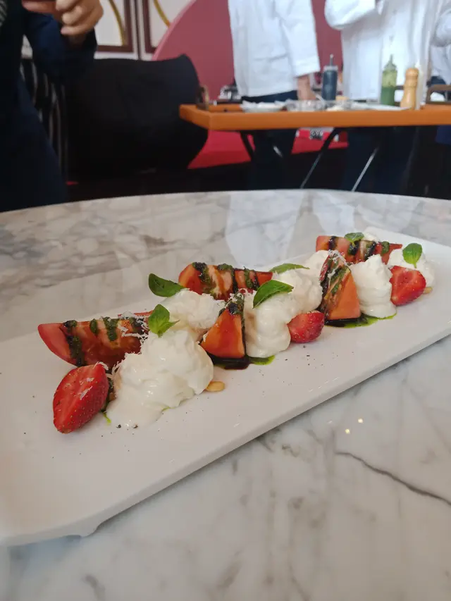 Strawberry salad, tomato, parmesan and basil