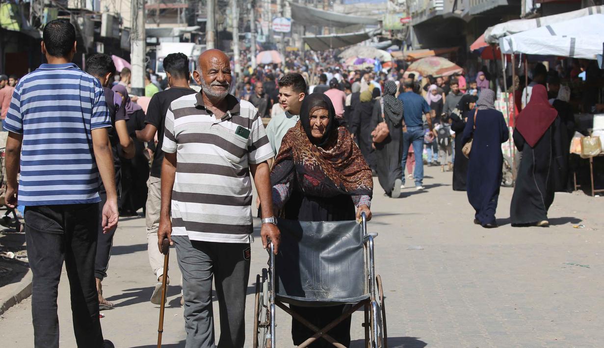 Diketahui, pembukaan perbatasan ini menjadi salah satu bagian dari perjanjian gencatan senjata Israel dan Hamas. Gencatan senjata mulai berlaku sejak Jumat 10 Oktober 2025. (Eyad BABA/AFP)