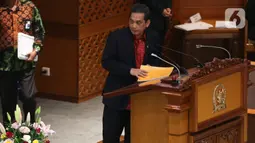 Menteri Perdagangan Agus Suparmanto menyampaikan pandangan pemerintah saat Rapat Paripurna ke-10 di Senayan, Kamis (6/2/2020). DPR mengesahkan Undang-Undang Perjanjian Perdagangan Bebas Indonesia-Australia Comprehensive Economic Partnership Agreement (IA-CEPA). (Liputan6.com/Johan Tallo)