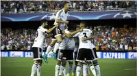 SELEBRASI - Para pemain Valencia melakukan selebrasi usai mencetak gol kedua ke gawang AS Monaco. (AFP PHOTO/ BIEL ALINO)