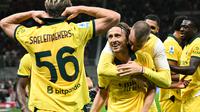 Pemain AC Milan, Luka Modric, merayakan gol yang dicetaknya ke gawang Bologna pada pekan 3 Liga Italia Serie A di Stadion San Siro, Senin (15/9/2025) dini hari WIB. (Stefano RELLANDINI / AFP)