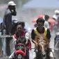 Tradisi pacuan kuda di Gayo, Takengon, Aceh Tengah, yang diikuti para joki cilik yang gagah berani (Chaideer Mahyuddin/AFP)