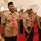 Ketua Kwarnas Pramuka Budi Waseso (kiri) saat menghadiri upacara pelepasan Kontingen Gerakan Pramuka Indonesia di Istana Negara, Jakarta, Jumat (19/7/2019). Pramuka Indonesia akan terbang ke Virginia Barat untuk menghadiri Jambore Pramuka Dunia XXIV. (Liputan6.com/Angga Yuniar)