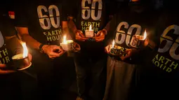 Earth Hour merupakan kampanye untuk mematikan lampu listrik selama satu jam lamanya. (JUNI KRISWANTO/AFP)