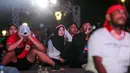Ekspresi kecewa para penonton saat nonton bareng pertandingan perebutan juara ketiga Piala Asia U-23 2024 antara Timnas Indonesia U-23 melawan Irak U-23 di Kompleks Monumen Nasional (Monas), Jakarta, Kamis (03/05/2024). (Bola.com/Bagaskara Lazuardi)