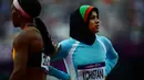 Tahmina Kohistani menjadi satu-satunya wanita yang mewakili Afganistan di Olimpiade London 2012. Kohistani berlomba di nomor lari 100m dan 200m putri. (AFP/Olivier Morin)