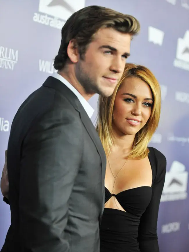 Miley Cyrus dan Liam Hemsworth. (AFP/TOBY CANHAM)
