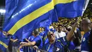 Hasil imbang tersebut juga memastikan Curacao mengakhiri fase grup sebagai pemuncak klasemen dengan 12 poin, unggul satu poin dari Jamaika.Tampak dalam foto, suporter Timnas Curacao merayakan hasil imbang melawan Jamaika pada Grup B Kualifikasi Piala Dunia 2026 zona CONCACAF di Independence Park Stadium, Jamaika pada 18 November 2025. (Ricardo MAKYN/AFP)