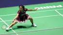 Meski sempat tertinggal hingga interval babak awal, Gregoria Mariska Tunjung langsung tancap gas dan berhasil memimpin sekaligus mengamankan gim pertama. (Dimitar DILKOFF/AFP)