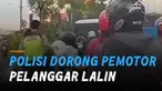 Beredar video seorang polisi dorong pemotor pelanggar lalu lintas sampai jatuh.