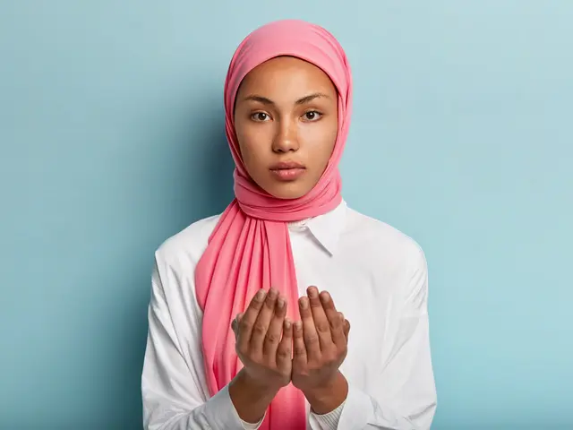 062093800 1609746586 african muslim woman makes traditional prayer god keeps hands praying gesture
