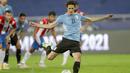 Edinson Cavani yang maju menjadi eksekutor berhasil menuntaskan tugasnya dengan baik. Skor 1-0 untuk keunggulan Uruguay atas Paraguay. (AP/Silvia Izquierdo)