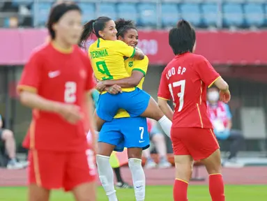 Debinha yang sudah berumur 29 tahun merupakan motor serangan bersama Malta dan diharapkan mampu mendulang banyak gol bagi Brasil. Ia saat ini sudah mencetak 41 gol termasuk satu golnya ke gawang Tiongkok pada pertandingan penyisihan grup F sepak bola wanita. (Foto: AFP/Kohei Chibagara)