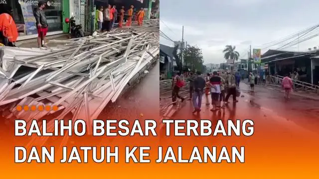 Sebuah insiden baliho berukuran besar terbang dan jatuh ke jalan mengundang perhatian.