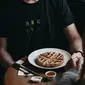 Couple go for a breakfast with waffles (Photo by Guilherme Cunha on Unsplash)