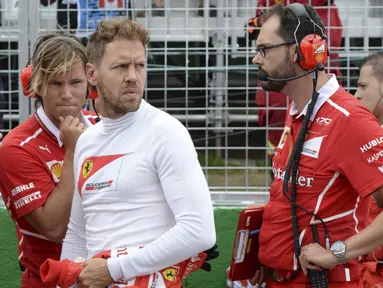 Pebalap Ferrari, Sebastian Vettel saat ini masih memimpin puncak klasemen semetara F1 2017 dengan jumlah poin sebanyak 153. (Paul Chiasson/The Canadian Press via AP)