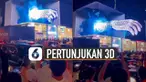 Terlihat visual tiga dimensi saat itu menunjukkan tangan kanan seperti keluar dari layar.