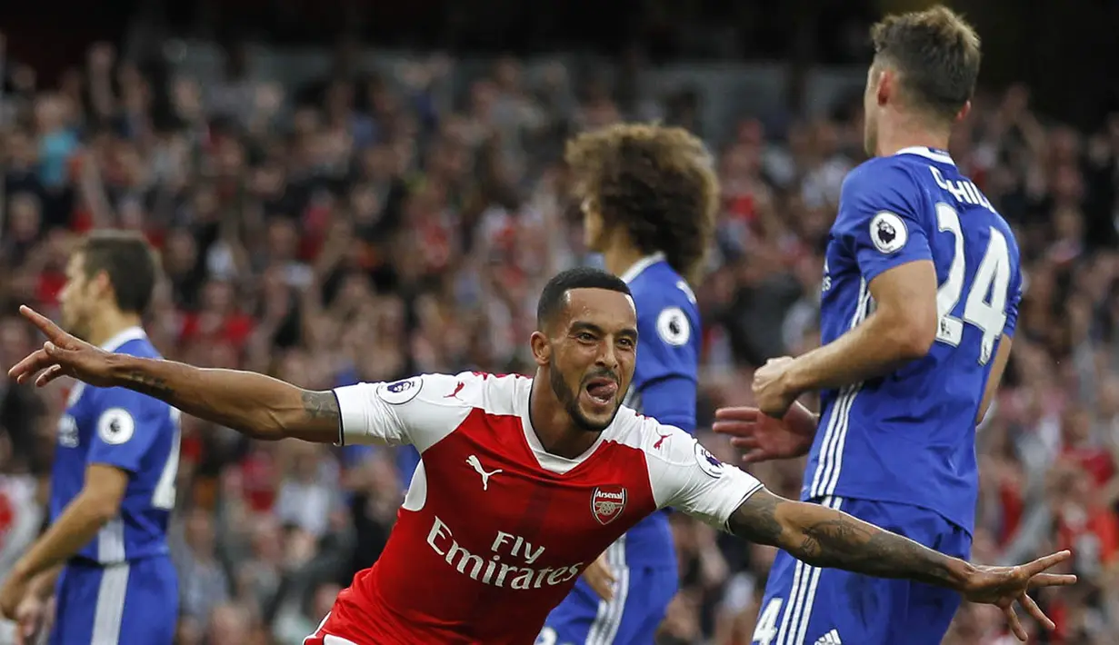 Arsenal berhasil memenangi big match kota London melawan rivalnya Chelsea. The Gunners mempermalukan tamunya, The Blues, dengan skor 3-0 melalui gol Alexis Sanchez, Theo Walcott dan juga Mesut Ozil. (AFP/Ian Kington)