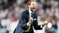 Pelatih Timnas Inggris, Gareth Southgate, meluapkan kebahagiaan usai membawa anak asuhnya mengalahkan Denmark pada laga semifinal Euro 2020 di Stadion Wembley, Kamis (8/7/2021). (Foto:AFP/Frank Augstein,Pool)