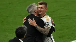 Toni Kroos menutup kariernya sebagai pesepak bola professional secara gemilang. (Ben Stansall/AFP)