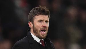 Legenda lini tengah Old Trafford itu akan memimpin The Red Devils hingga akhir musim ini. Tampak dalam foto, Michael Carrick saat masih menjadi pelatih sementara Manchester United memberi isyarat di pinggir lapangan selama pertandingan sepak bola Liga Premier Inggris melawan Arsenal di Old Trafford, Manchester, Inggris barat laut, pada 2 Desember 2021. (Oli SCARFF/AFP)