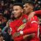 Striker Manchester United, Mason Greenwood, bersama Marcus Rashford merayakan gol ke gawang Newcastle pada laga Premier League di Stadion Old Trafford, Manchester, Rabu (26/12). MU menang 4-1 atas Newcastle. (AFP/Paul Ellis)