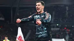 Kemenangan ini membawa Bayern Muenchen kini mengoleksi 61 poin dari 24 pertandingan, unggul 11 poin dari Bayer Leverkusen yang berada pada posisi kedua. (Tom Weller/dpa via AP)