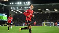 Striker Manchester United Cristiano Ronaldo merayakan golnya ke gawang Everton dalam pertandingan Liga Inggris di Stadion Goodison Park, Liverpool, Senin (10/10/2022) dini hari WIB. MU menang 2-1 atas Everton. (Oli SCARFF / AFP)