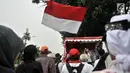 Massa yang tergabung dalam Gerakan Jaga Indonesia (GJI) mendengarkan orasi saat menggelar aksi di depan Balai Kota, Jakarta, Kamis (29/11).  (Merdeka.com/Iqbal S. Nugroho)