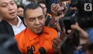 Wakil Menteri Imigrasi dan Pemasyarakatan (Wamen Imipas), Silmy Karim, saat menuju mobil tahanan usai menjalani pemeriksaan intensif di Gedung Merah Putih Komisi Pemberantasan Korupsi (KPK), Jakarta, Kamis (4/6/2026). (Liputan6.com/Helmi Fithriansyah)