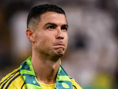 Cristiano Ronaldo merasa diperlakukan tidak adil oleh pemilik klub, PIF. Ia merasa Al-Nassr dianaktirikan dibanding klub raksasa lainnya seperti Al-Hilal. (AFP/Fayez Nureldine)