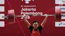 Eko Yuli menambah emas kelima di Asian Games 2018, setelah menjadi juara di kelas 62 kilogram putra dan meraih medali emas dengan total angkatan 311 kilogram. (merdeka.com/Imam Buhori)
