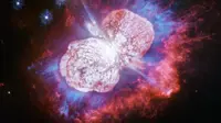 Eta Carinae, bintang jauh yang menyemburkan nebula kembar dari gas merah, putih dan biru. (Kredit: NASA, ESA, N. Smith (Universitas Arizona) dan J. Morse (BoldlyGo Institute))
