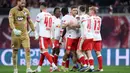 Kemenangan tersebut membuat RB Leipzig menempati posisi ketiga dengan raihan 50 poin. Hal itu juga turut memanaskan perebutan tiket liga Champions musim depan bersama VfB Stuttgart dan TSG 1899 Hoffenheim yang memiliki poin sama. (AFP/Ronny Hartmann)