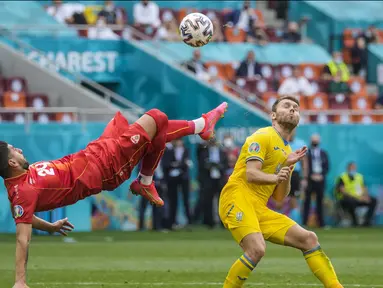 Ukraina berhasil memetik tiga poin pertama mereka di Euro 2020. Berhadapan dengan Makedonia Utara, Ukraina berhasil menang dengan skor 2-1 di pertandingan matchday kedua Grup C Euro 2020. (Foto: AP//Pool/Vadim Ghirda)