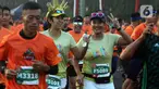 Peserta mengikuti l kegiatan lomba lari bertajuk Lo Gue Run (LGR) 2020 di Kompleks Monas, Jakarta Pusat, Minggu (26/1/2020). Kejuaraan LGR 2020 yang diikuti oleh total 3.500 pelari tersebut merupakan rangkaian kegiatan HUT Kodam Jaya ke 70. (Liputan6.com/Johan Tallo)