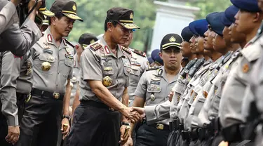 Kapolri Jenderal Pol Sutarman saat mengahadiri apel pengamanan pelantikan presiden dan wakil presiden di halaman Monumen Nasional, Jakarta, Jumat (17/10/2014) (Liputan6.com/Faizal Fanani)