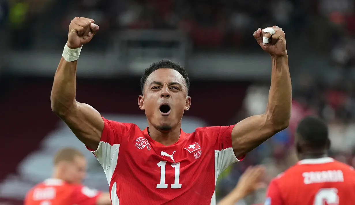 Pemain Swiss Dan Ndoye  melakukan selebrasi  setelah mencetak gol kedua timnya selama pertandingan sepak bola babak 32 besar Piala Dunia antara Swiss dan Aljazair di Vancouver, British Columbia, Kamis, (02/07/2026). (AP Photo/Abbie Parr)