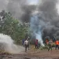 Simulasi penanganan kebakaran lahan di Kabupaten Siak oleh Satgas Karhutla Riau. (Liputan6.com/M Syukur)