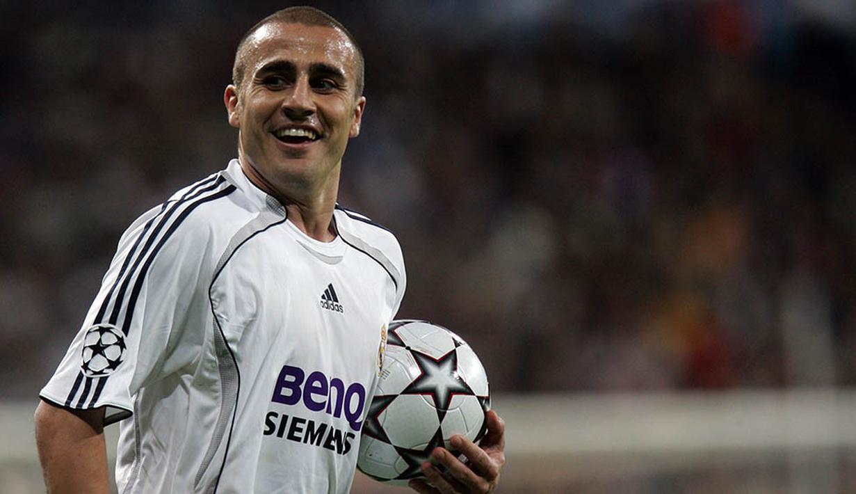 3. Fabio Cannavaro - Kasus Calciopoli membuatnya meninggalkan Juventus untuk bergabung dengan Real Madrid. Namun selang tiga tahun kemudian kembali ke Turin dengan status bebas transfer. (Photo by BRU GARCIA / AFP)